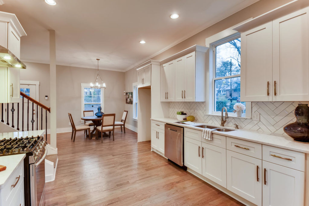 real estate image of kitchen with window over sink