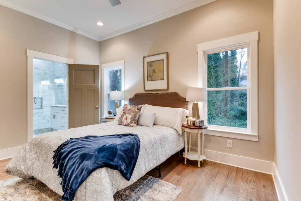 real estate listing of bedroom with blue blanket