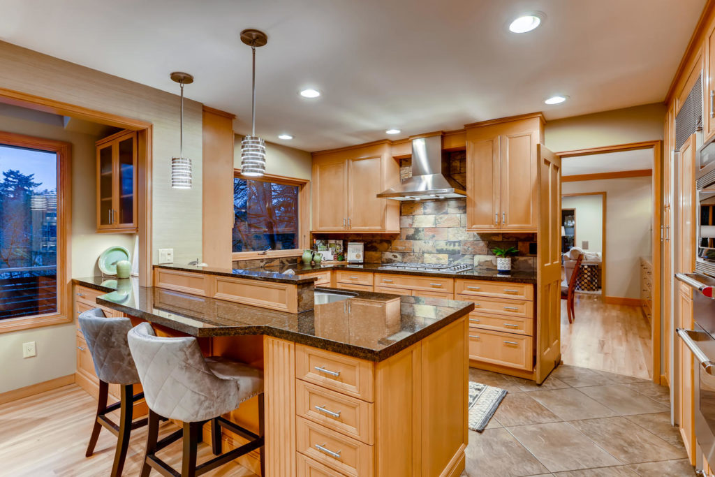 real estate image of kitchen with range and island