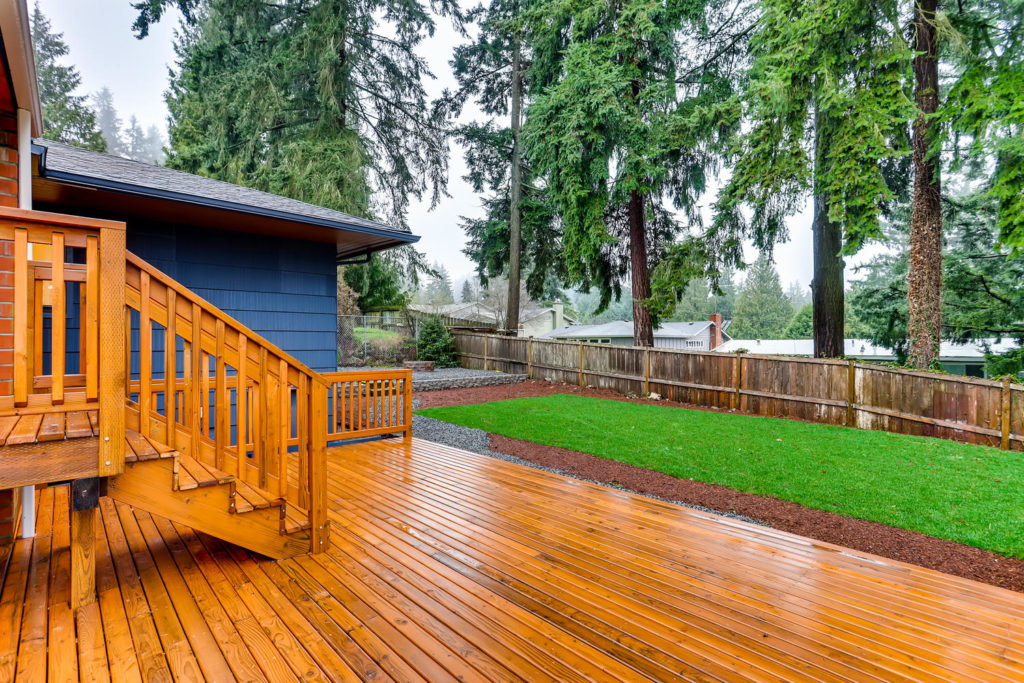real estate image of backyard and deck