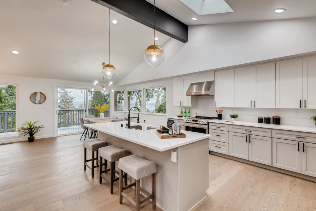 Kitchen with white cabinets and counters