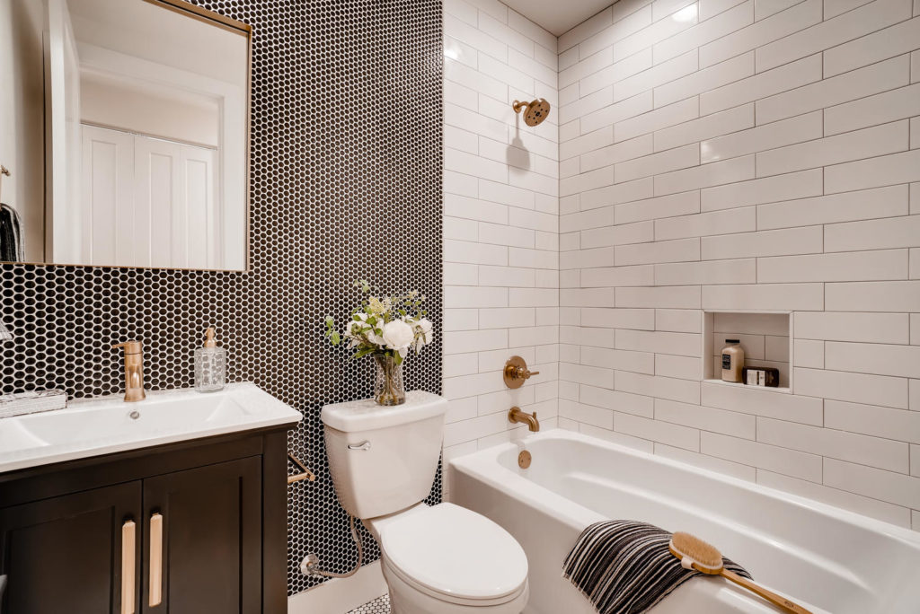 Bathroom with black tiling