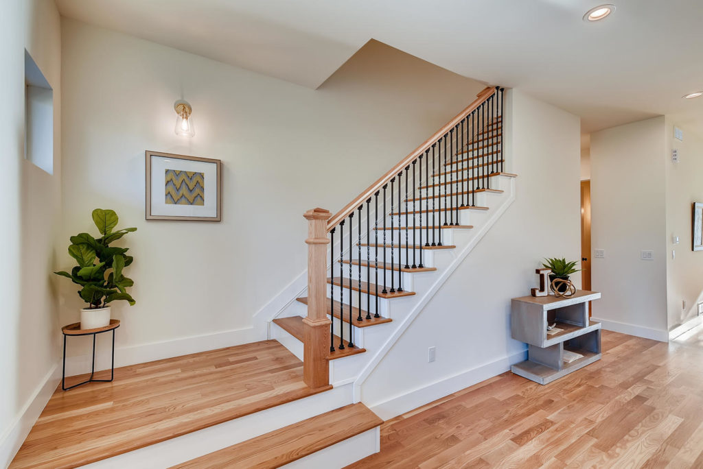Foyer with hardwood floors and landing