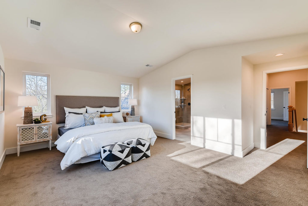 Large bedroom with white comforter