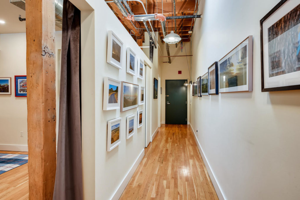Hallway with gallery wall in loft