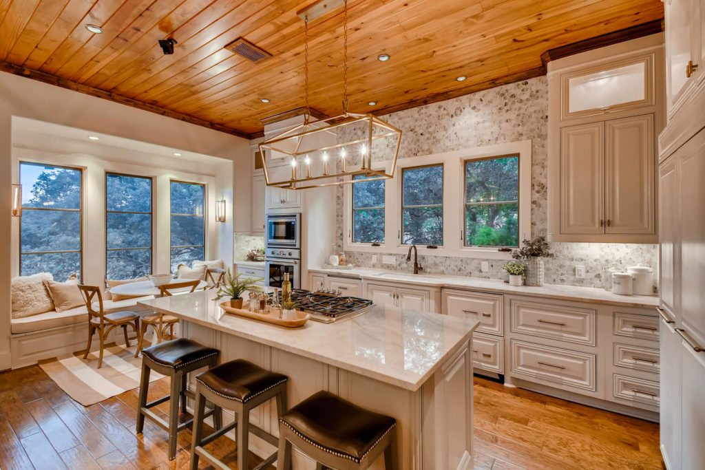 Kitchen with island and wood paneling