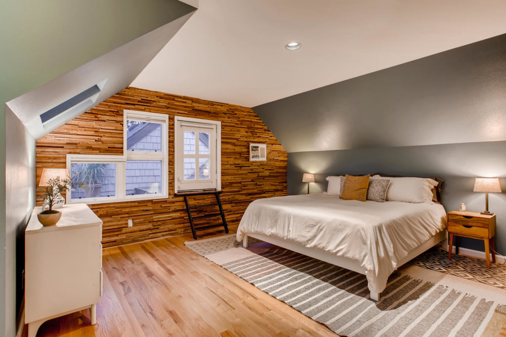 Bedroom with wood panel walling