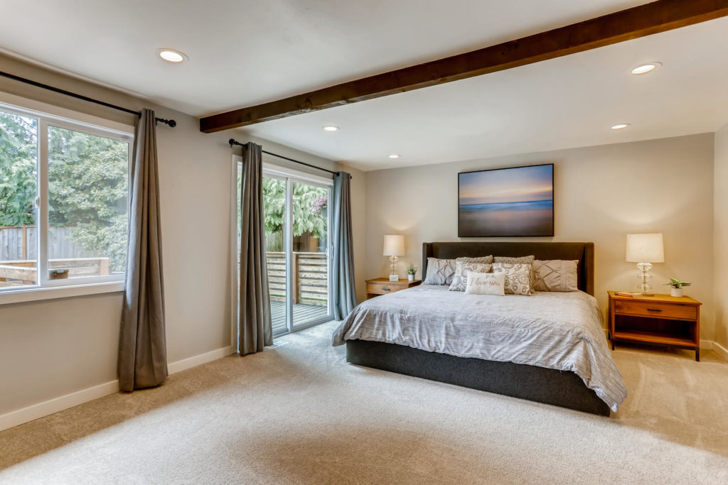 Large bedroom with wood beam