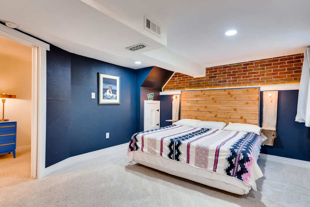 Large bedroom with navy walls