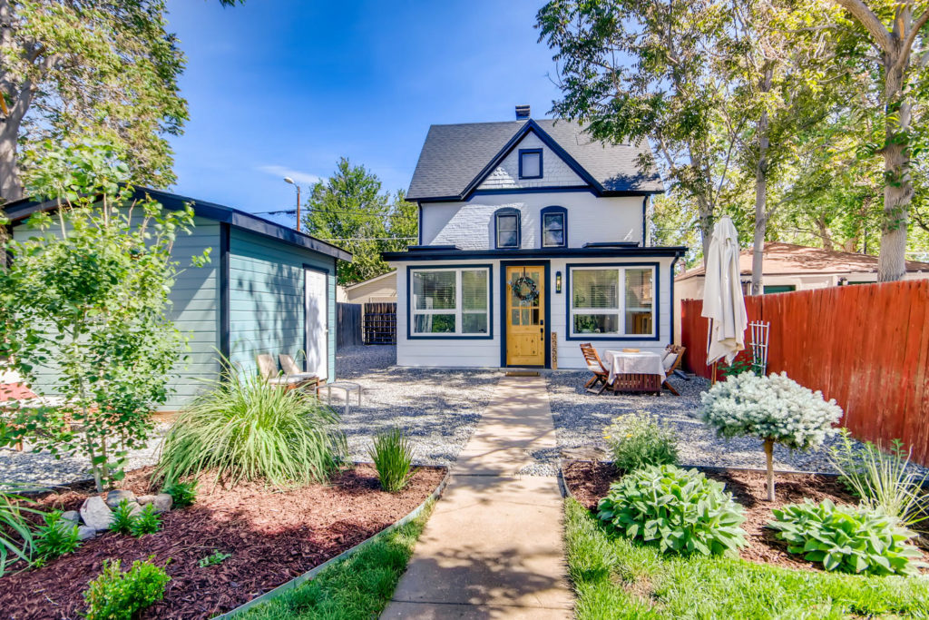 Denver bungalow with white siding and dark trim