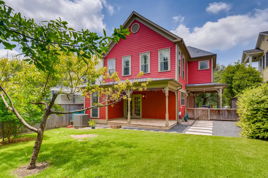 backyard red house - real estate image