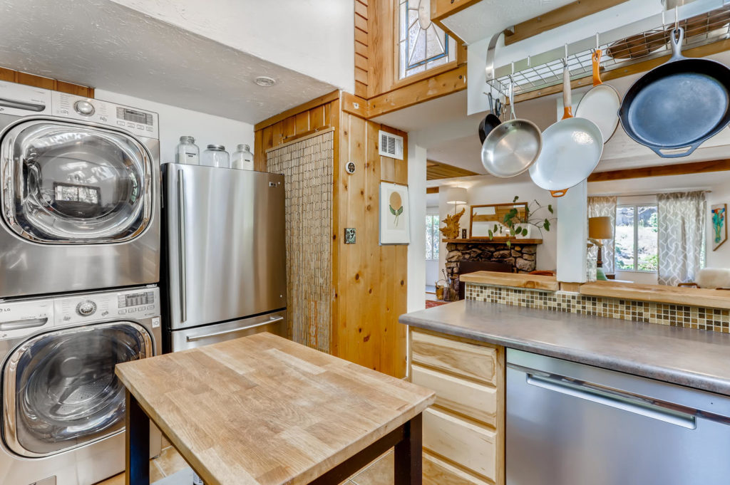 real estate photography - kitchen with stacked washer dryer