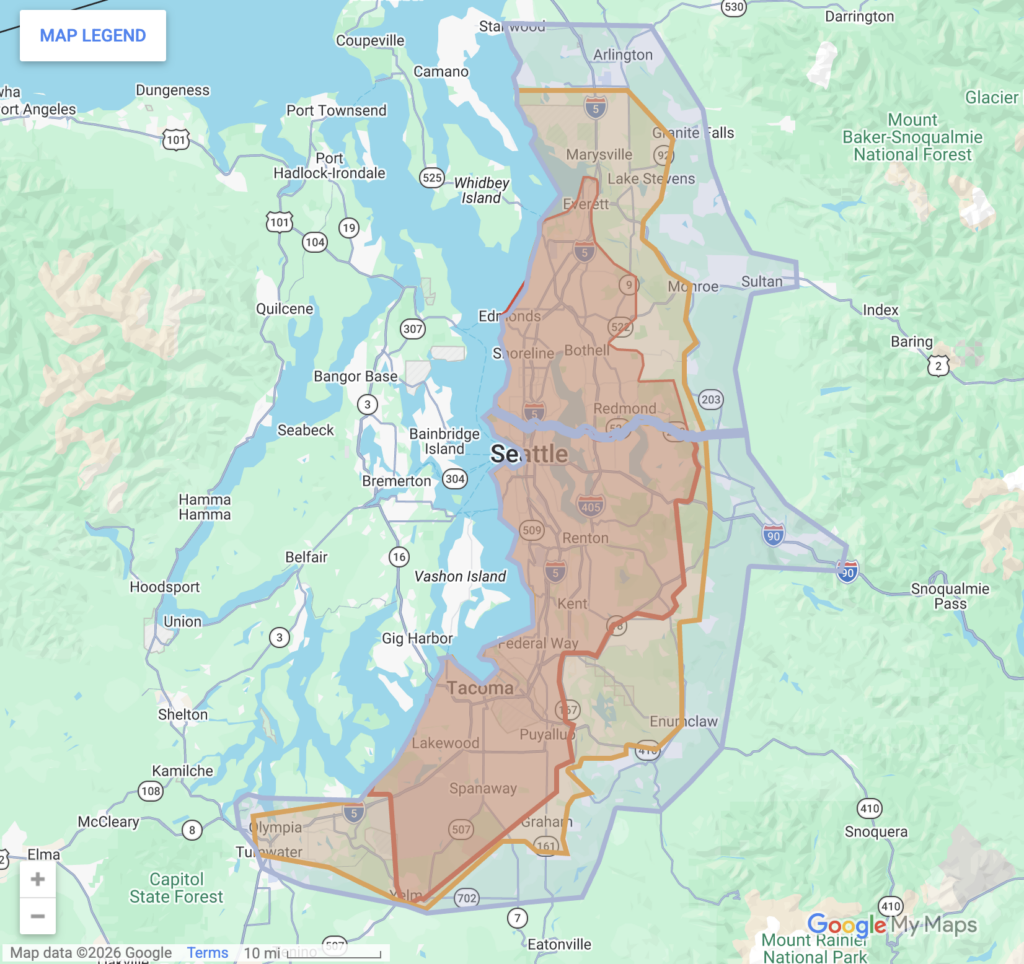 A Google Maps screenshot showing Virtuance's service area in the Seattle-Tacoma, Washington market. The core coverage area is highlighted in red and orange shading, extending north to Marysville and Everett, south through Seattle, Renton, Kent, Tacoma, and Lakewood, down to Olympia. A larger secondary border outlined in blue encompasses extended surrounding regions.