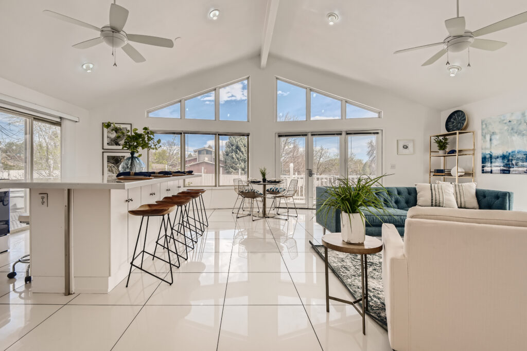 A bright room with large windows and natural light.