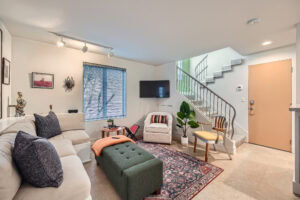real estate image of living room and staircase