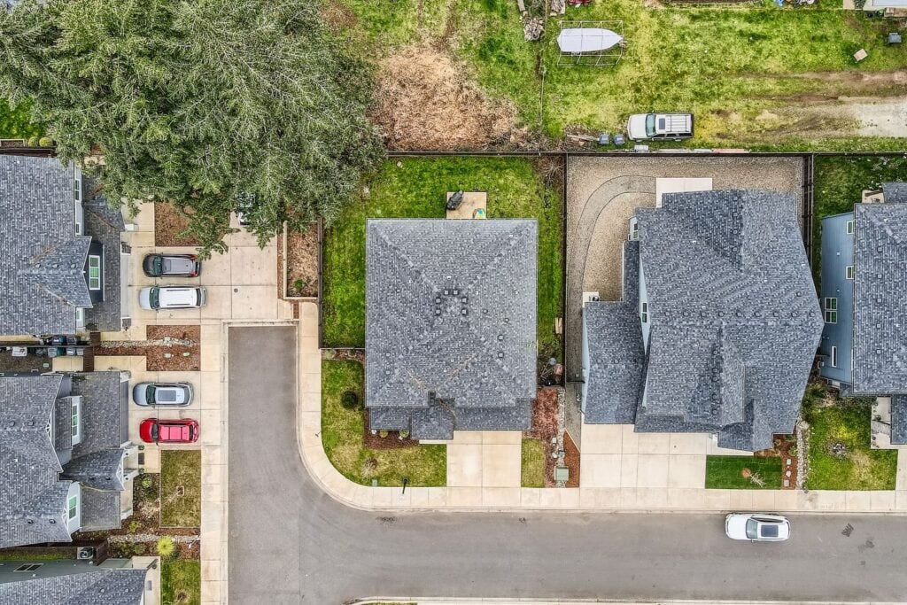 aerial satellite view of a residential property and surround yard captured by Virtuance
